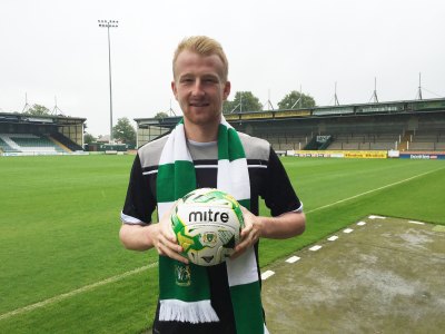 Mark Beck signs for the Glovers